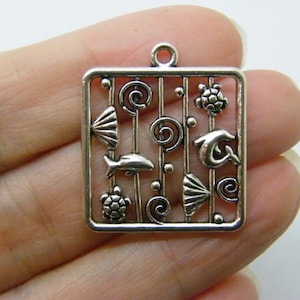 May include: Silver charm with a square frame and various sea life designs including a dolphin, fish, seashells, and turtles.