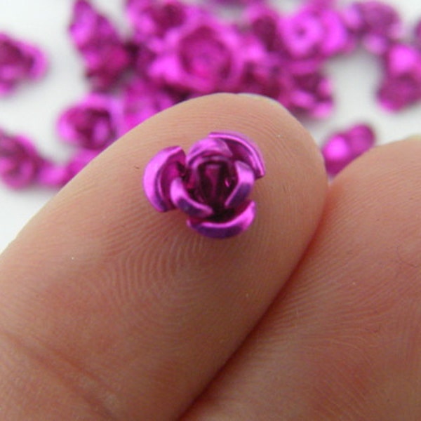 100 Fuchsia metal flower spacer beads 7 x 4mm