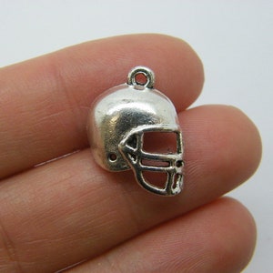 16 American football helmet charms antique silver tone SP30