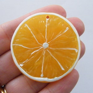 2 Orange  slice pendants charms resin FD169