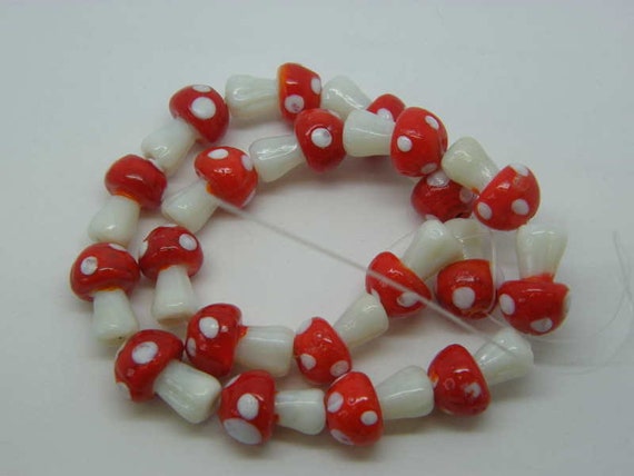 Bead, lampworked glass, opaque white and red, 13x12mm-15x14mm mushroom with  spots. Sold per pkg of 8. - Fire Mountain Gems and Beads