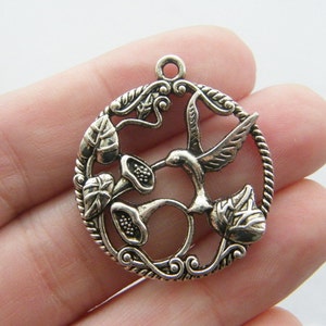 4 Humming bird charms antique silver tone B141