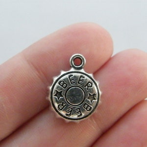 12 Beer bottle caps charms antique silver tone FD167