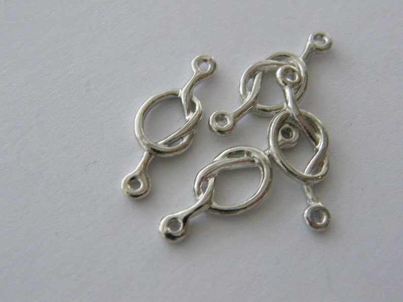 BULK 30 love knot connector charm antique silver tone R111