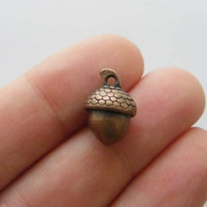 6 Acorn charms antique copper tone L89