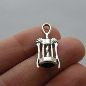 May include: Silver-toned metal corkscrew charm with a detailed design. The charm is small and would be perfect for jewelry making or crafting.
