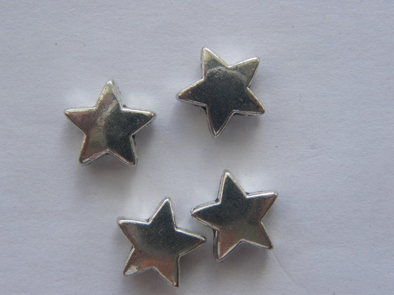 10 Runde Plättchen Mit Ausstanzung "Stern" In Antik Silberfarben