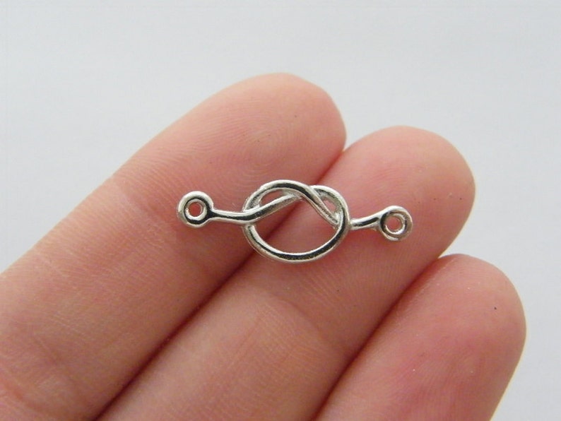 BULK 30 love knot connector charm antique silver tone R111