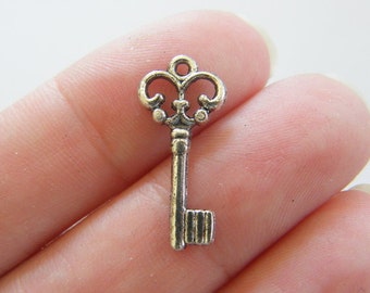 16 Key charms antique silver tone K4