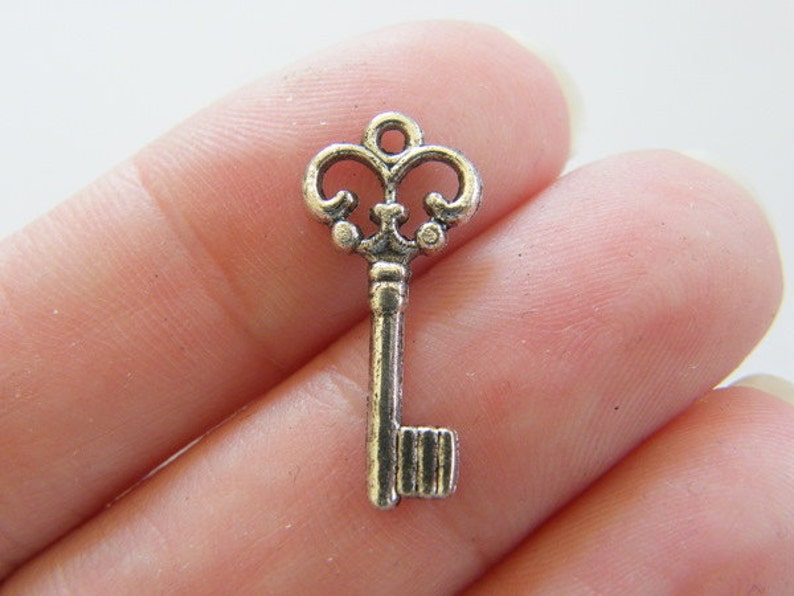 16 Key charms antique silver tone K4 image 1