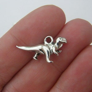 8 Dinosaur charms antique silver tone A176