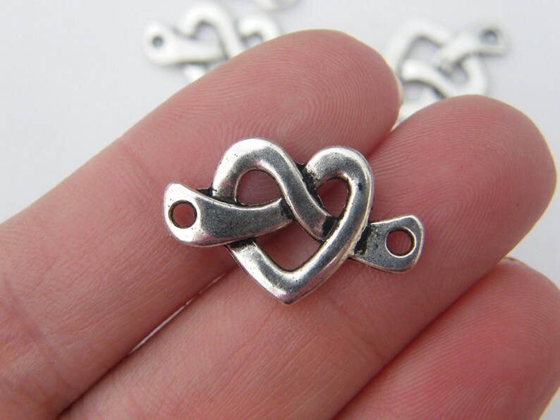 BULK 50 Feather charms antique silver tone B225