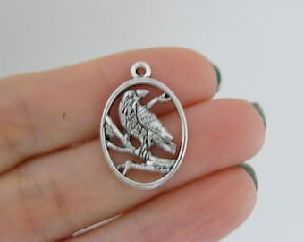 8 bedeltjes raafvogel antiekzilverkleur B11