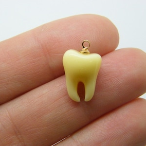 2 Tooth charms yellow resin gold bail MD4