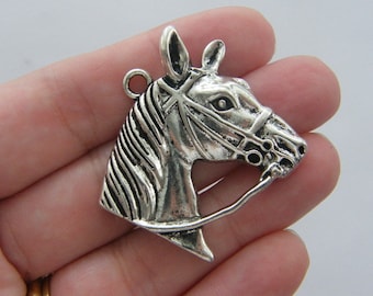 4 Horse pendants antique silver tone A591