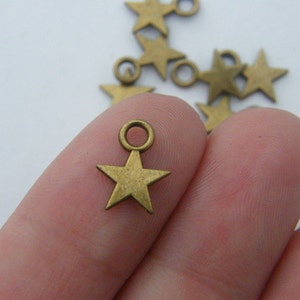 14 Star charms antique bronze tone S267