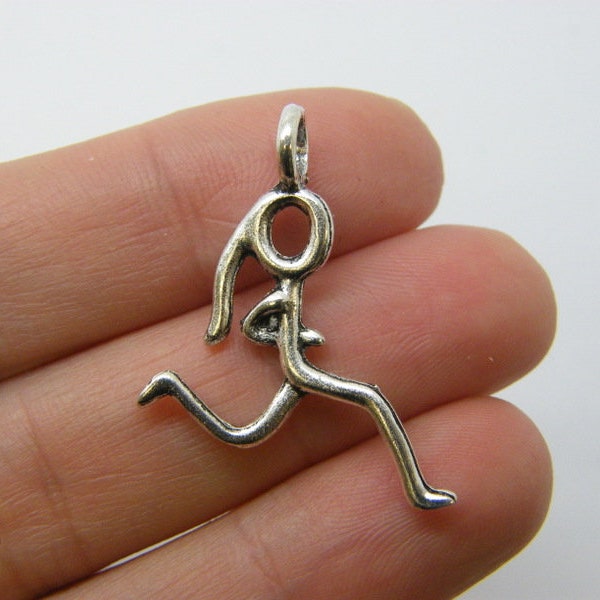 6 Running girl charms antique silver tone SP99