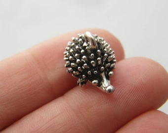 4 Hedgehog charms antique silver tone A656