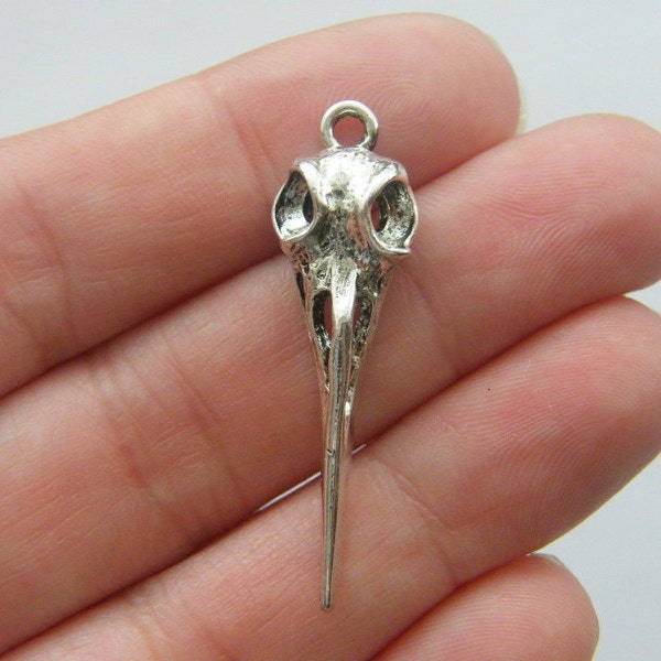 VRAC 20 pendentifs tête de mort d'oiseau ton argent antique B26