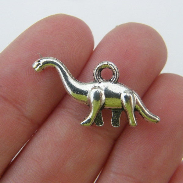 8 Dinosaur charms antique silver tone A177