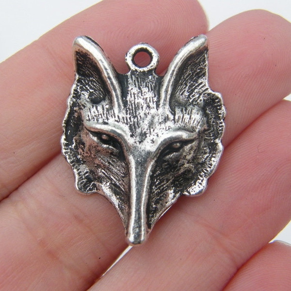 4 Wolf charms antique silver tone A287