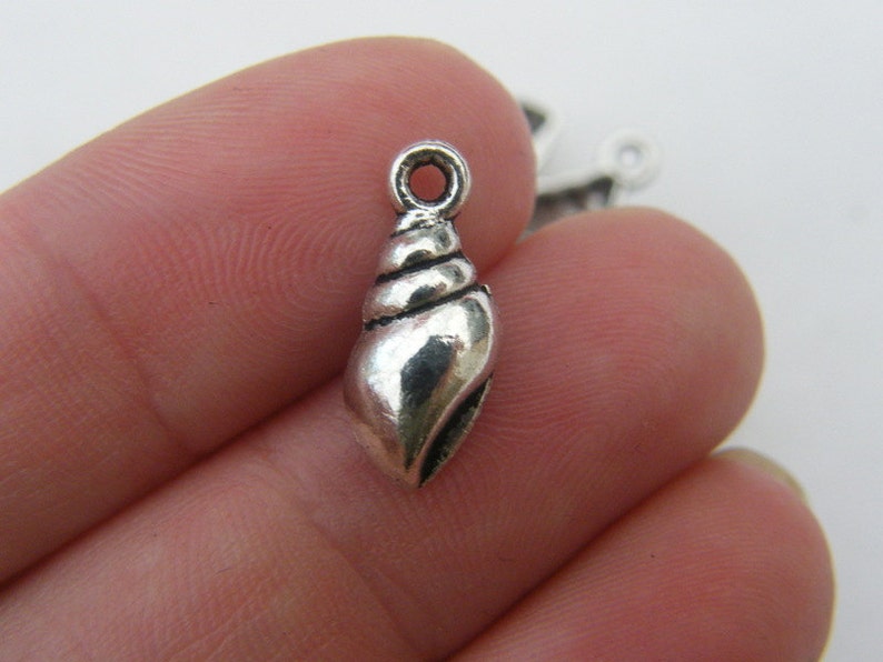 14 different antique silver tone charms The Shell Charms Collection