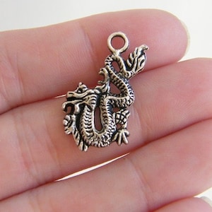 10 Dragon charms antique silver tone A69