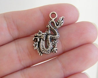 10 Dragon charms antique silver tone A69