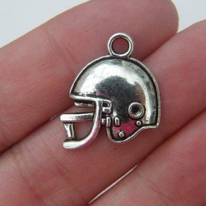 8 American football helmet charms antique silver tone SP13