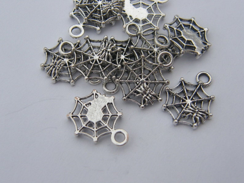 BULK 50 Spider in a spiderweb charms tibetan silver HC124