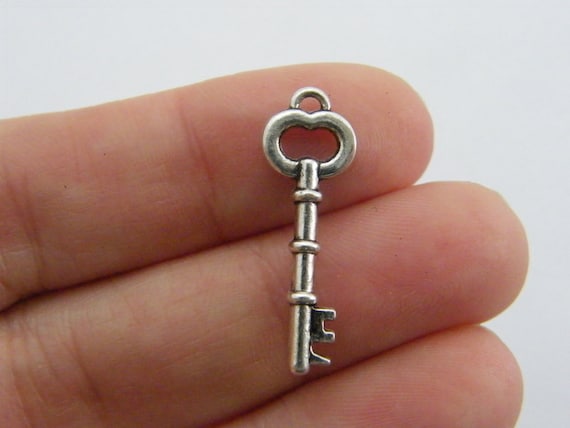 10 Key charms antique silver tone K51