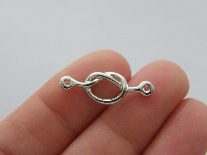 BULK 30 love knot connector charm antique silver tone R111