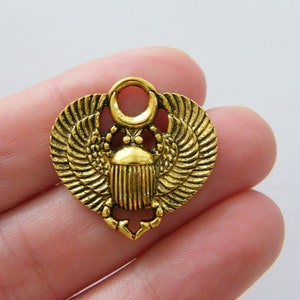 4 Scarab charms antique gold tone WT106