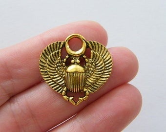 4 Scarab charms antique gold tone WT106