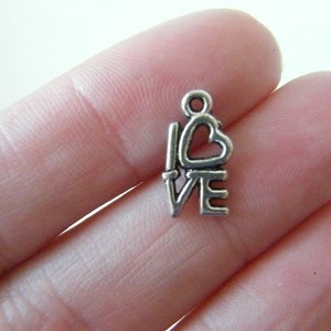 32 LOVE word charms antique silver tone M41