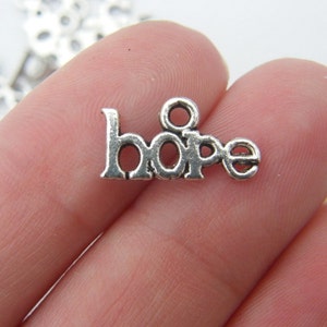 18 Hope charms antique silver tone M247