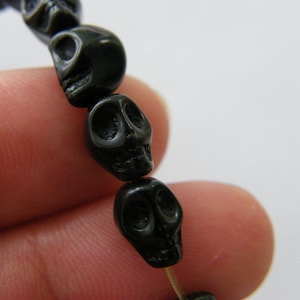 48 Black skull beads 8 x 6mm SK11