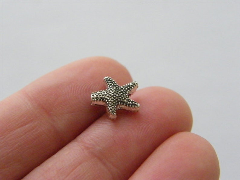 BULK 50 Starfish spacer beads antique silver tone FF529