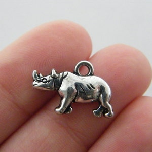 8 Rhino charms antique silver tone A12