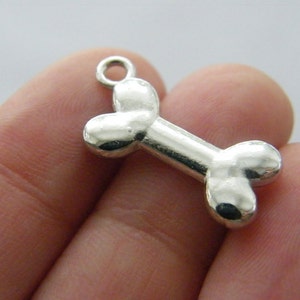 8 Bone charms silver tone A300