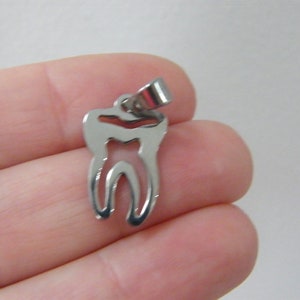 1 Tooth cut out pendant silver tone stainless steel MD30