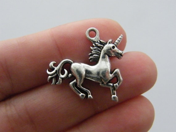 4 Unicorn charms antique silver tone A636