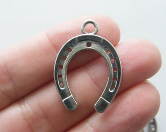 8 Horseshoe pendants  antique silver tone A551