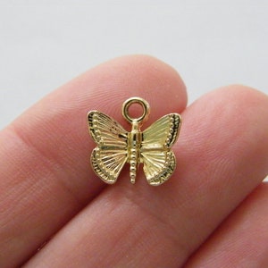 10 Butterfly charms gold tone A309