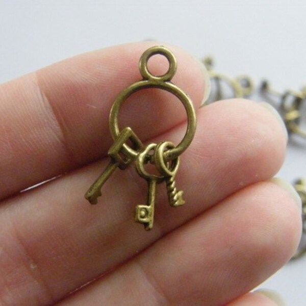 8 Key ring  charms antique bronze tone K60