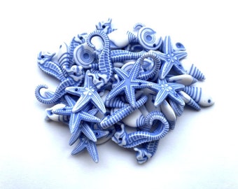 100 Blue random sea themed acrylic charms