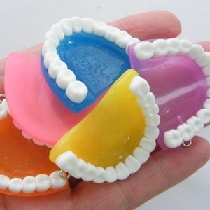 4 False teeth pendants  random mixed resin  MD
