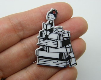2 Reading  on top of a pile of books pendants black white acrylic P45
