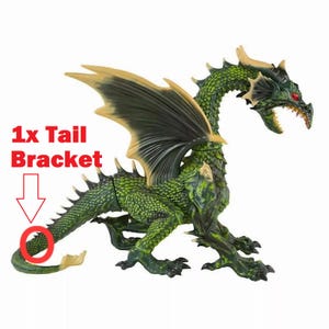 May include: Green plastic toy dragon with a long tail, wings, and red eyes. The dragon has a tail bracket, which is a piece that attaches to the tail to help it stand up.