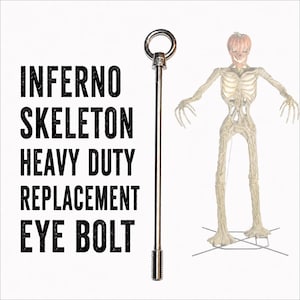 May include: A silver-colored metal eye bolt with a threaded end and a ring top, positioned next to a standing skeleton figure with a pumpkin head. The text INFERNO SKELETON HEAVY DUTY REPLACEMENT EYE BOLT is printed in black on the left side.